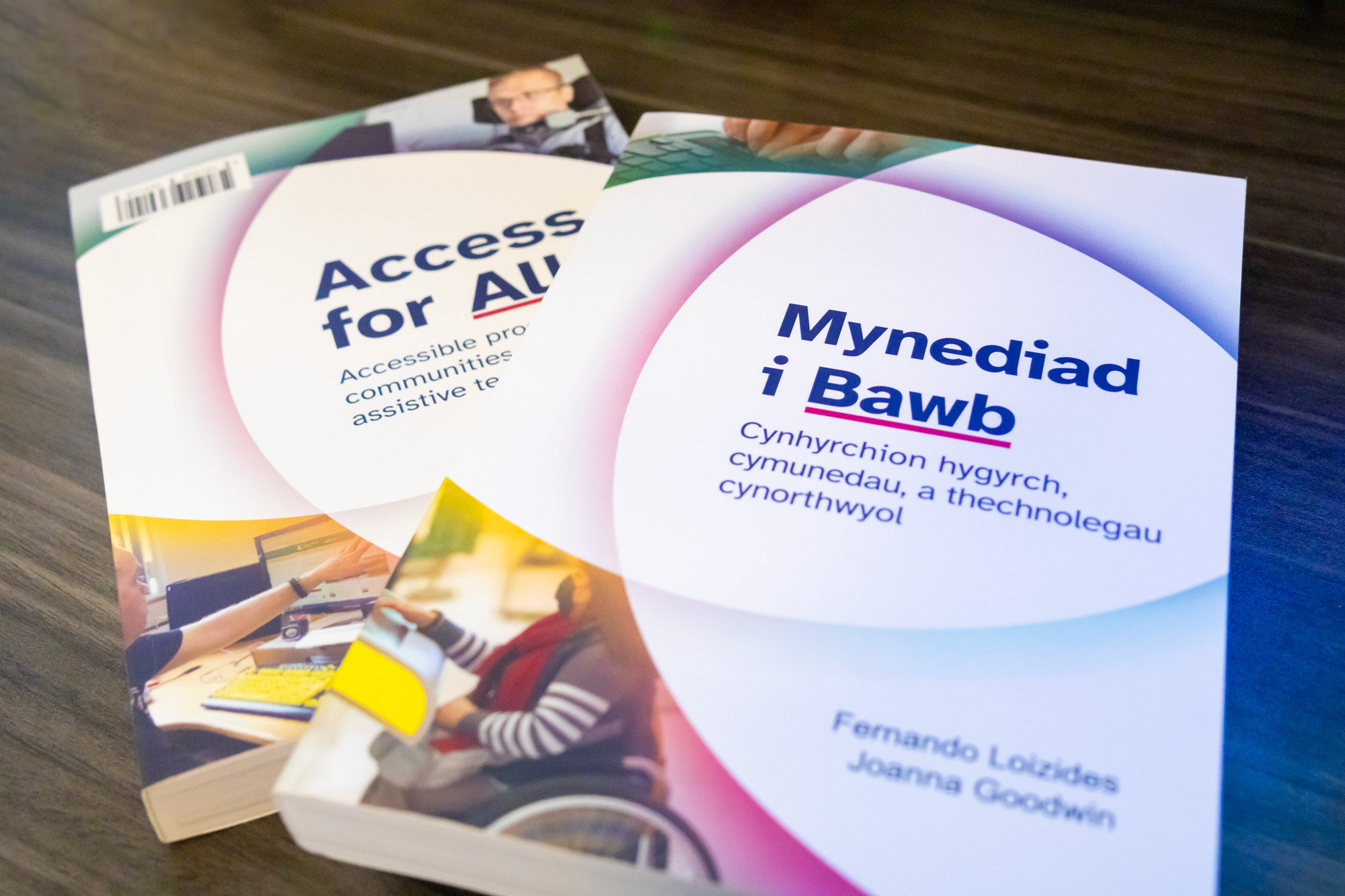 An image of the 'Access for All' book with both the English and Welsh covers