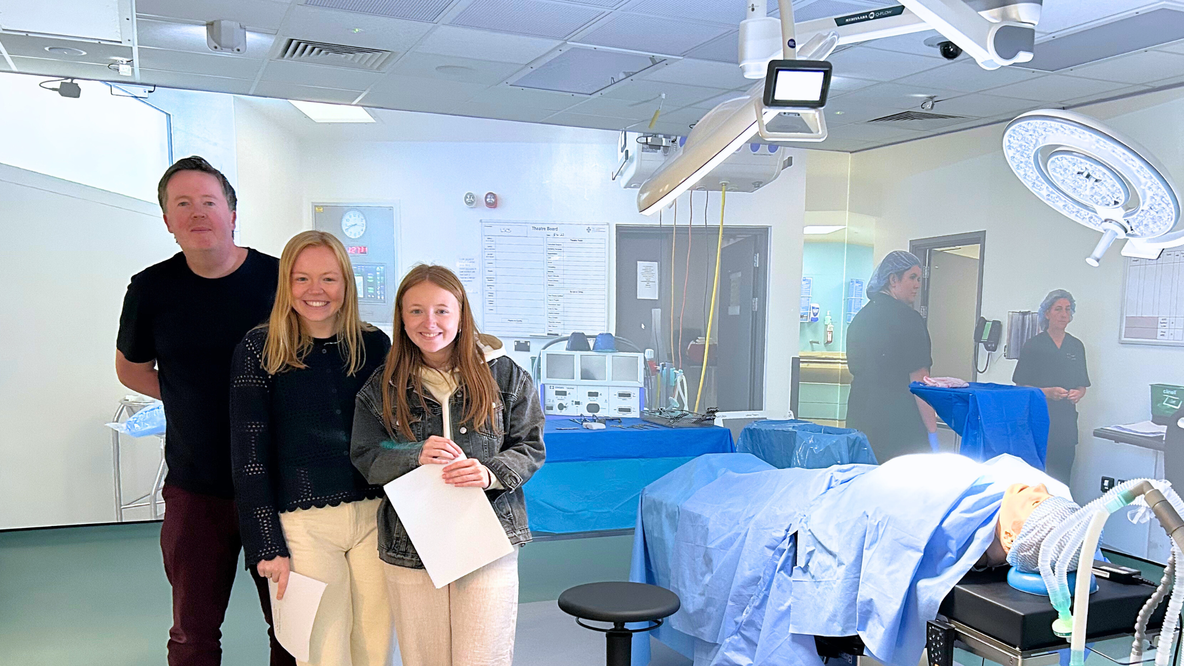 Dave and Alaw from the CDPS team with one of our actors, Manon, in the simulation suite at Swansea University.